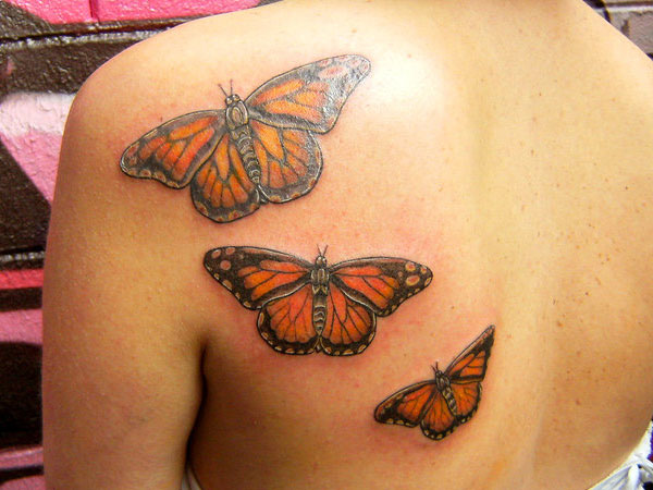 Monarch Butterflies Tattoo On Upper Back For Girls