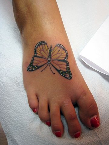 Monarch Butterfly Tattoo On Girl Foot