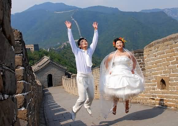 Newly Wedding Couple At The Great Wall Of China