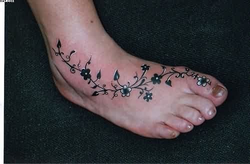 Nice Black And White Floral Vine Tattoo On Foot