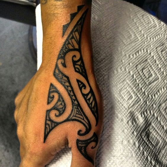 Nice Black Ink Tribal Tattoo On Right Hand