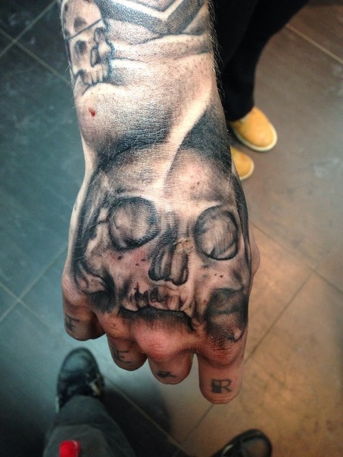 Nice Black Skull Tattoo On Man Hand