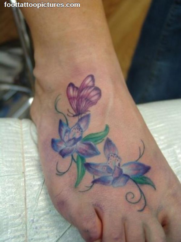 Nice Colored Butterfly Flowers Tattoo On Right Foot