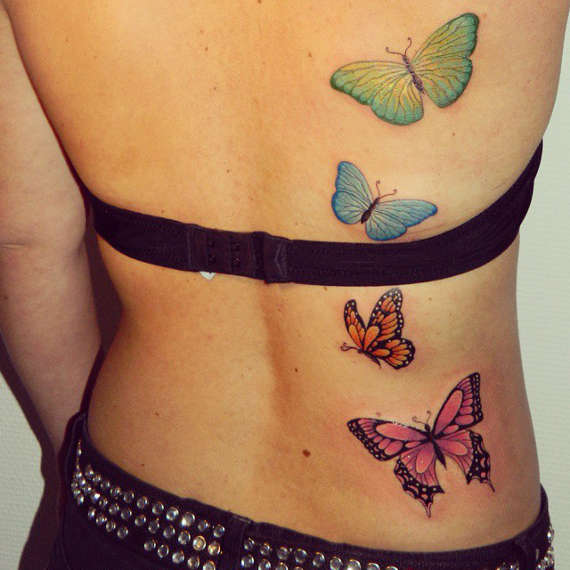 Nice Colorful Flying Butterflies Tattoo On Full Back For Women