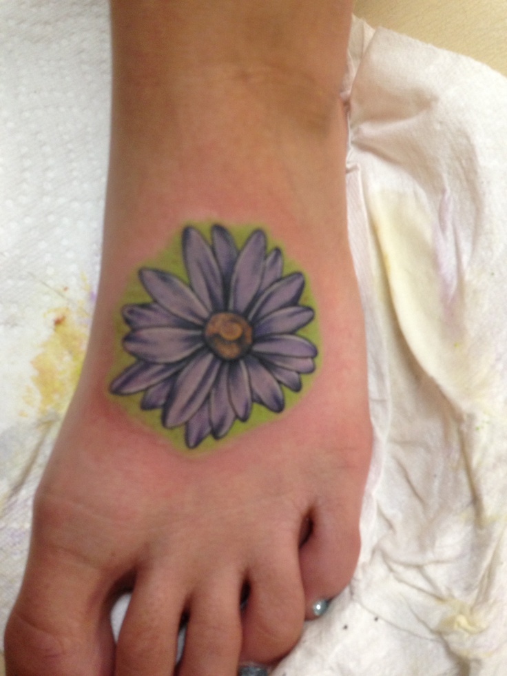 Nice Daisy Flower Tattoo On Foot