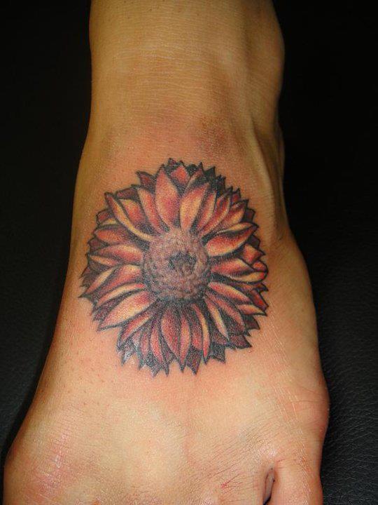 Nice Daisy Flower Tattoo On Girl Left Foot