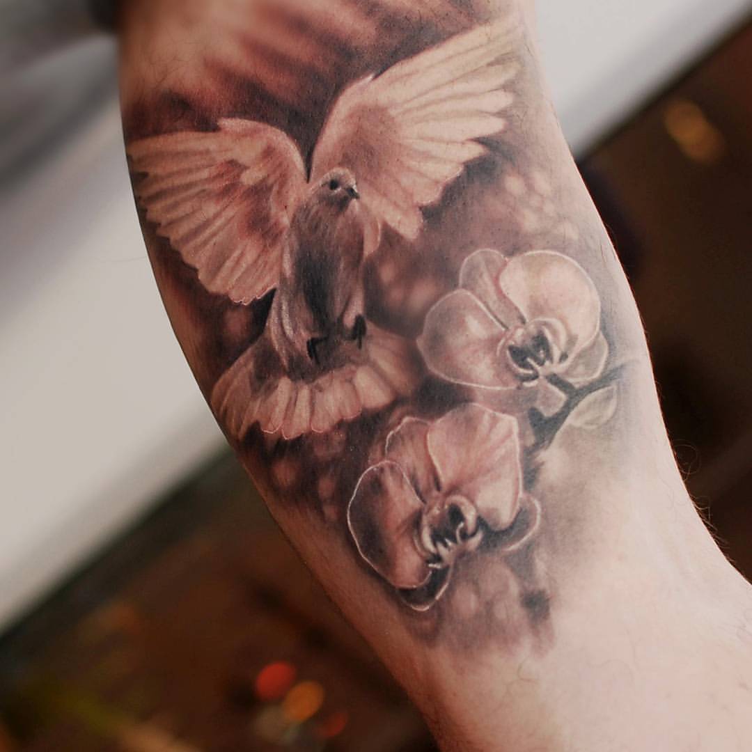 Nice Flowers And Flying Realistic Dove Tattoo