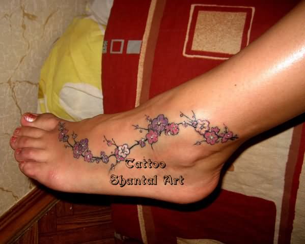 Nice Flowers Tattoo On Foot
