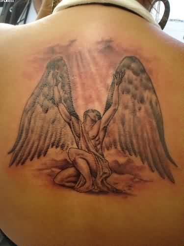 Nice Grey Ink Angel On Knee Tattoo On Upper Back