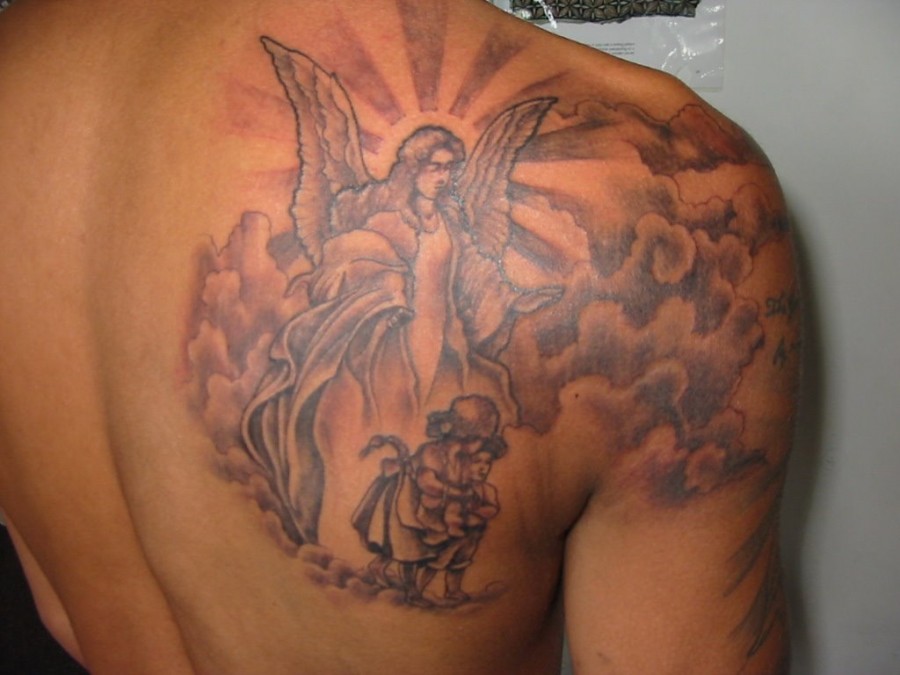 Nice Holy Angel Tattoo On Back Shoulder Blade For Men