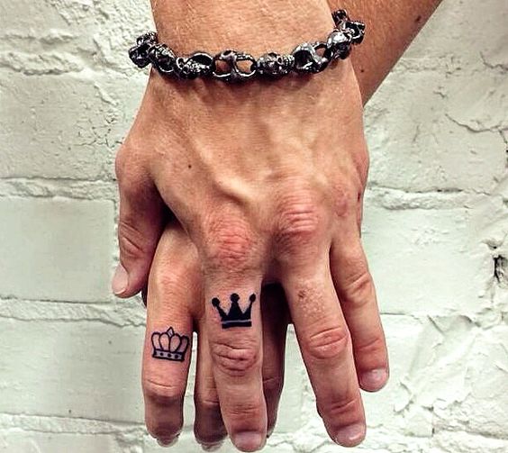 Nice Outline And Black Crown Tattoos On Fingers
