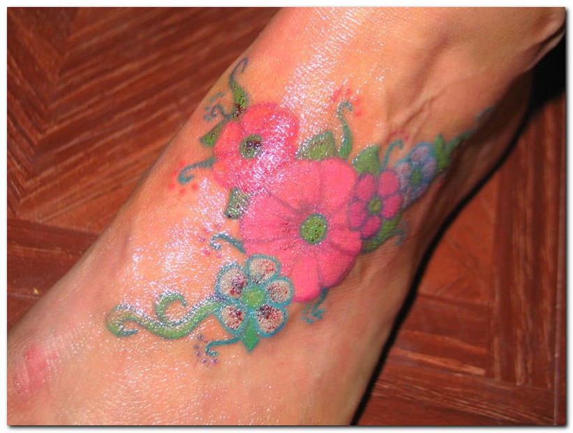 Nice Pink Flowers Foot Tattoo