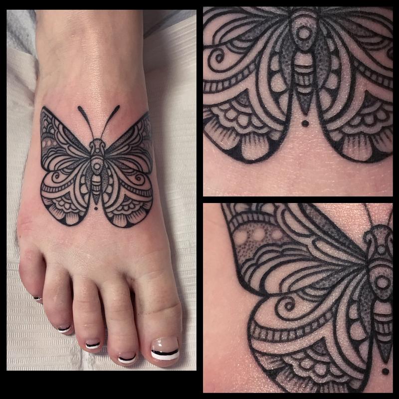 Nice Tribal Black Butterfly Tattoo On Foot