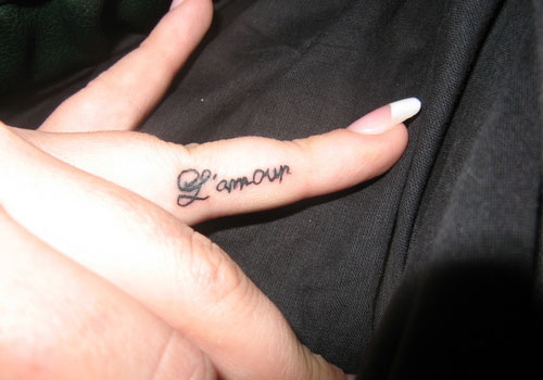 Of Amour Tattoo On Side Finger