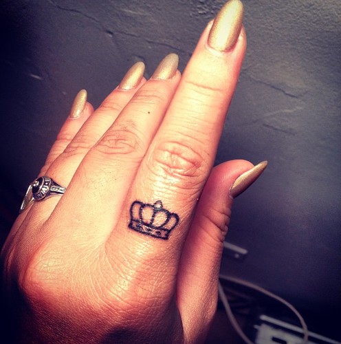 Outline Crown Tattoo On Girl Left Finger