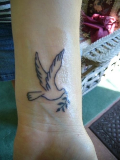 Outline Dove Tattoo On Left Wrist