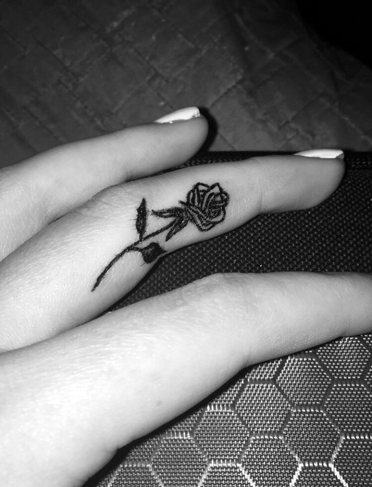 Outline Rose Flower Tattoo On Girl Side Finger
