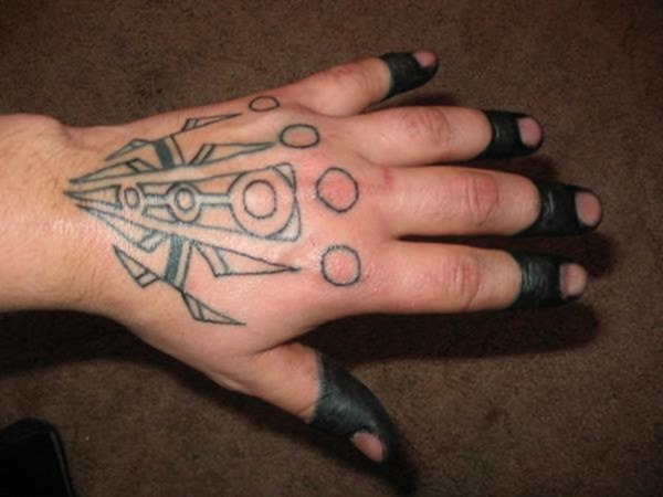 Outline Tribal Tattoo On Left Hand