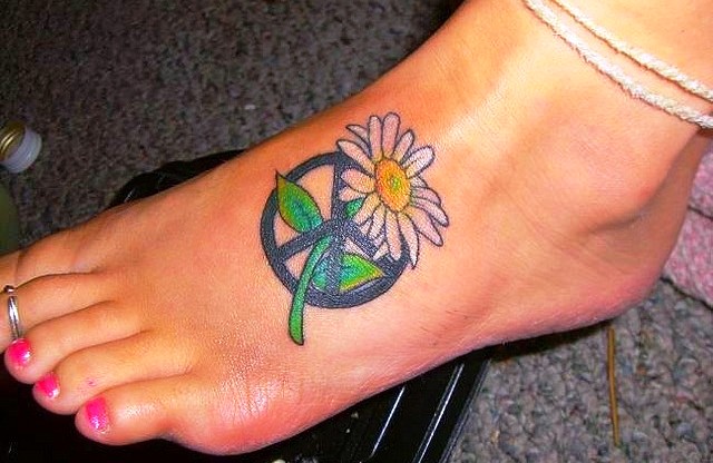 Peace Symbol And Daisy Tattoo On Girl Left Foot
