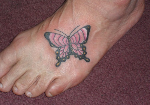 Pink And Black Butterfly Tattoo On Foot