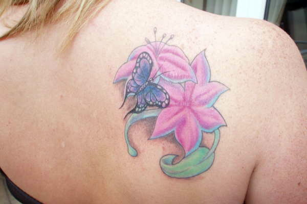 Pink Flowers With Butterfly Tattoo For Girls