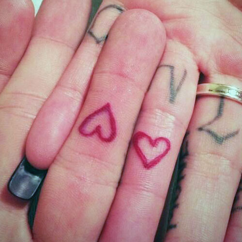 Pink Hearts Finger Tattoos