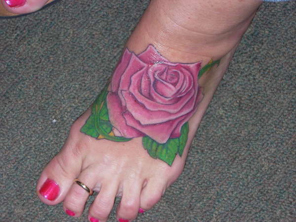 Pink Rose On Foot Tattoo For Women
