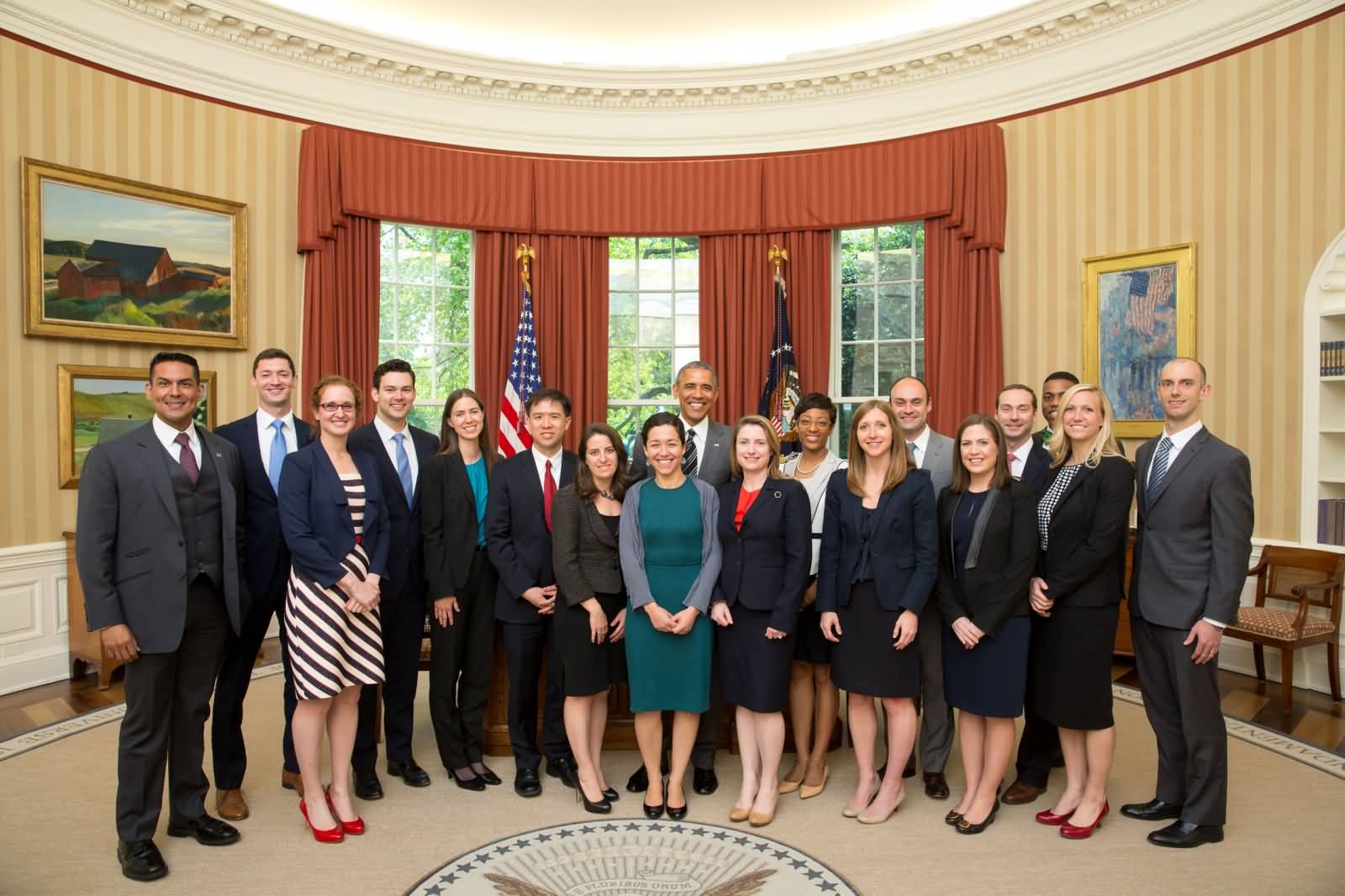 President Barack Obama Poses For A Group Photo In The Oval Office White House