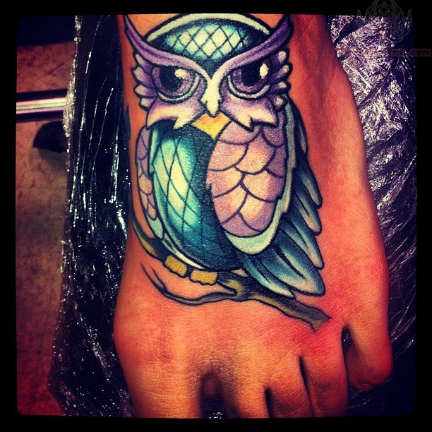 Purple And Blue Ink Owl Tattoo On Foot