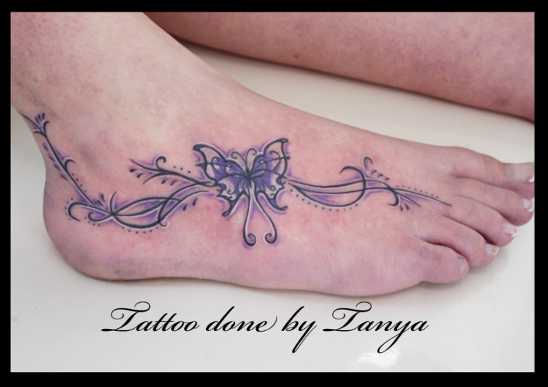 Purple Tribal Butterfly Tattoo On Foot