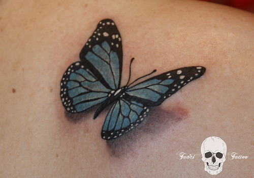 Realistic 3D Blue And Black Butterfly Tattoo