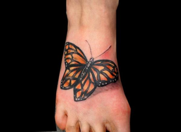 Realistic Black And Orange Butterfly Tattoo On Foot