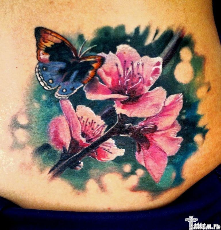 Realistic Butterfly And Flowers Tattoo On Lower Back