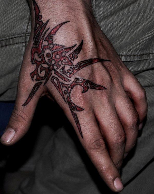Red And Black Tribal Hand Tattoo Idea