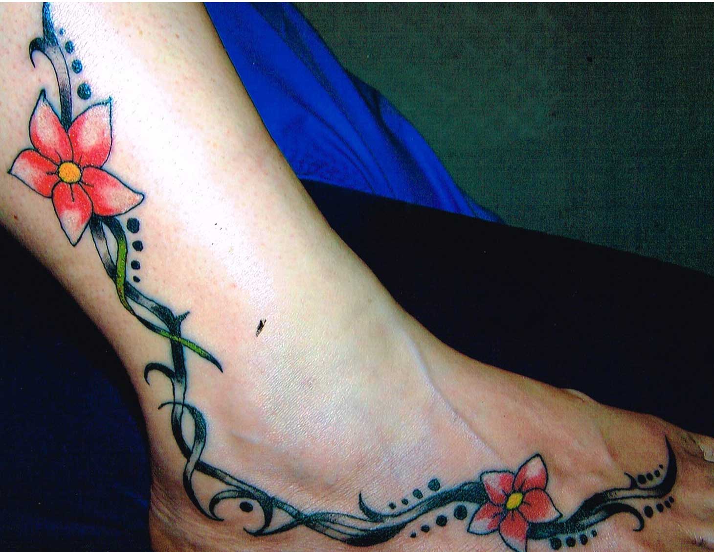 Red Flower Vine Tattoo On Leg To Foot