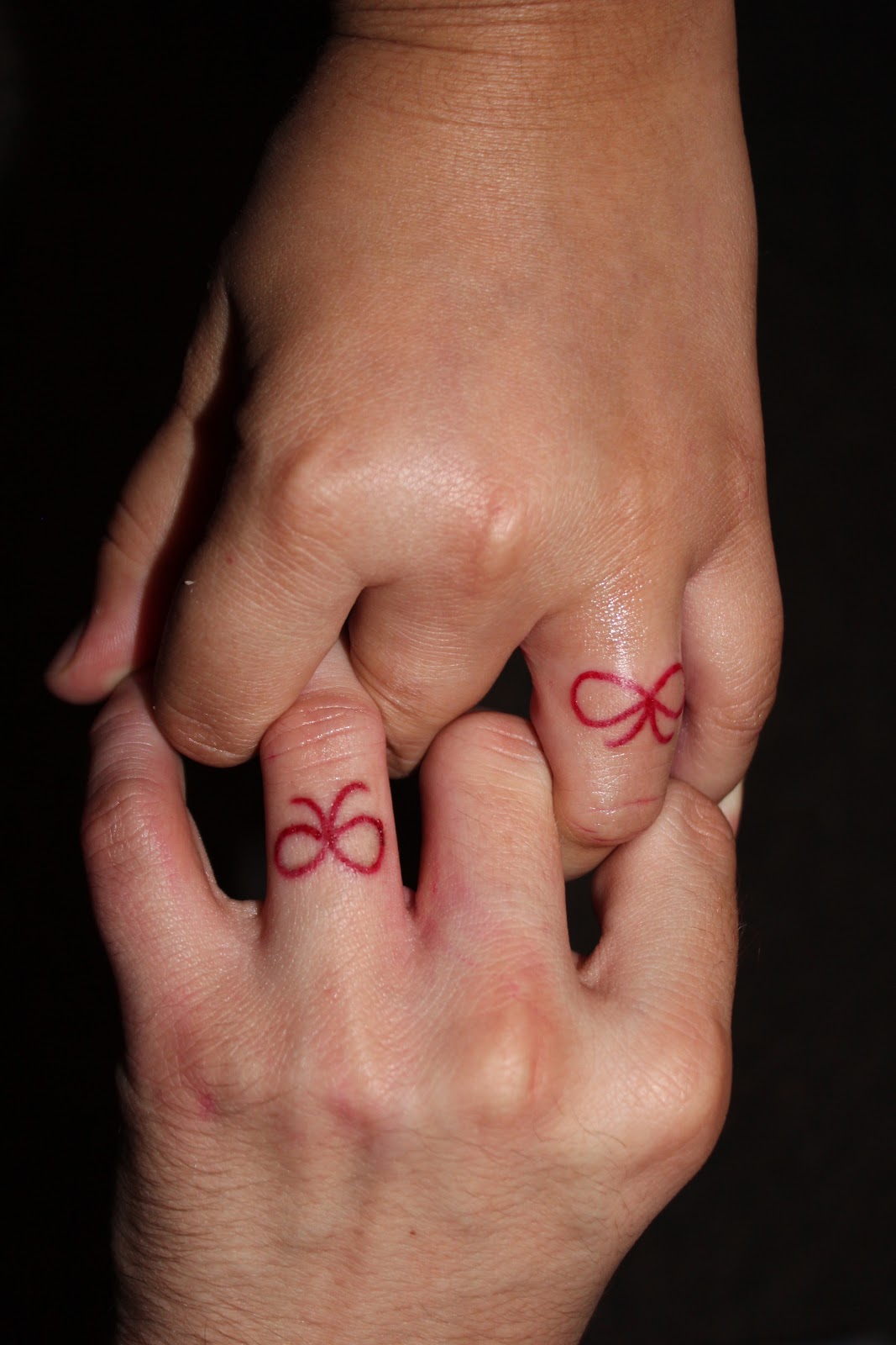 Red Line Bow Matching Tattoos On Finger