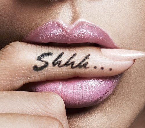 Rihanna With Shhh Tattoo On Side Finger