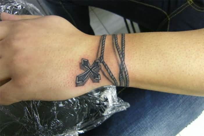 Rope With Cross Tattoo On Left Wrist
