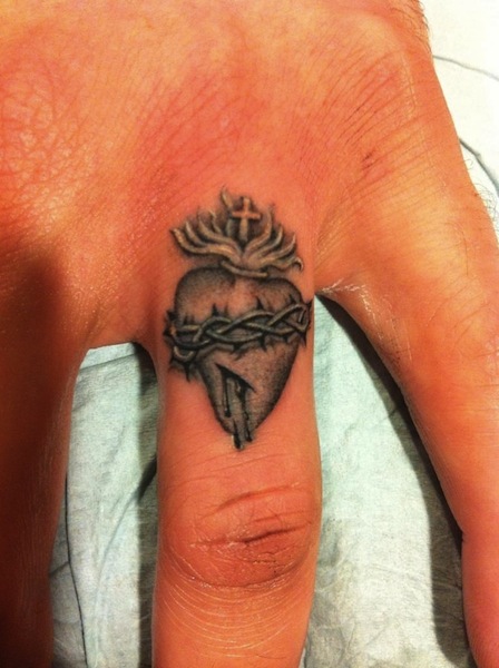 Sacred Heart Finger Tattoo