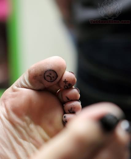 Sad Smiley Tattoo On Bottom Of Toe