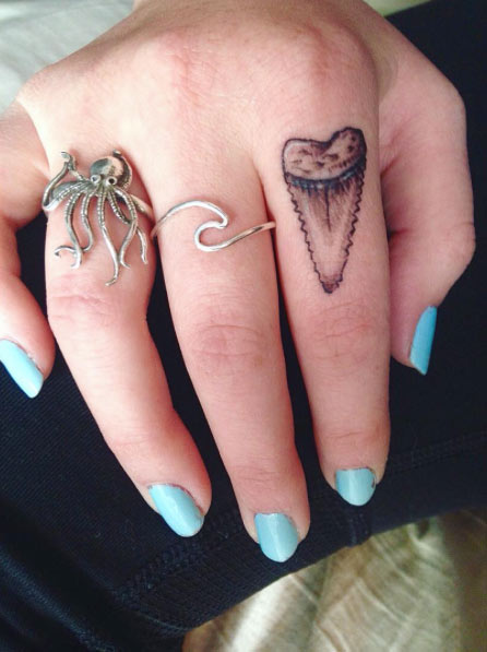 Shark Tooth Finger Tattoo On Girl Finger