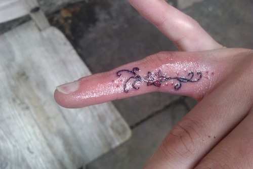 flower tattoo finger