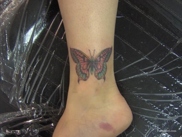 Simple Color Butterfly Tattoo On Ankle