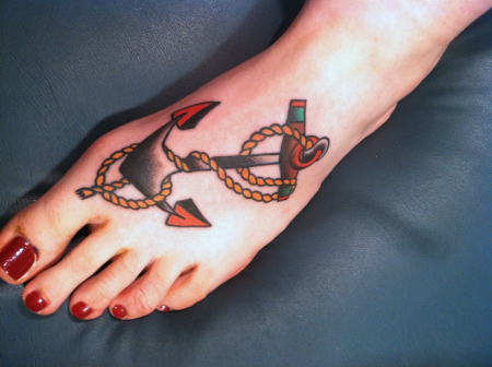Simple Color Traditional Anchor Tattoo On Women Foot