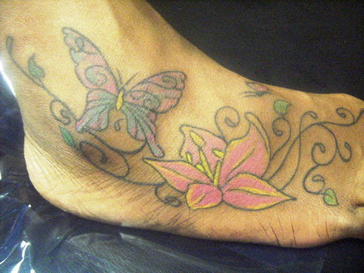 Simple Swirly Butterfly Flower Tattoo On Foot