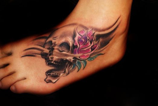 Skull With Traditional Rose Tattoo On Foot