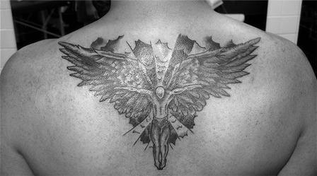Small Angel Tattoo On Upper Back