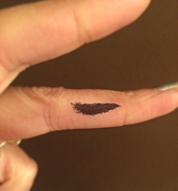 Small Black Feather Tattoo on Finger