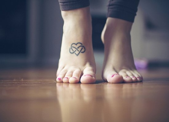 Small Black Infinity Heart Tattoo On Girl Foot