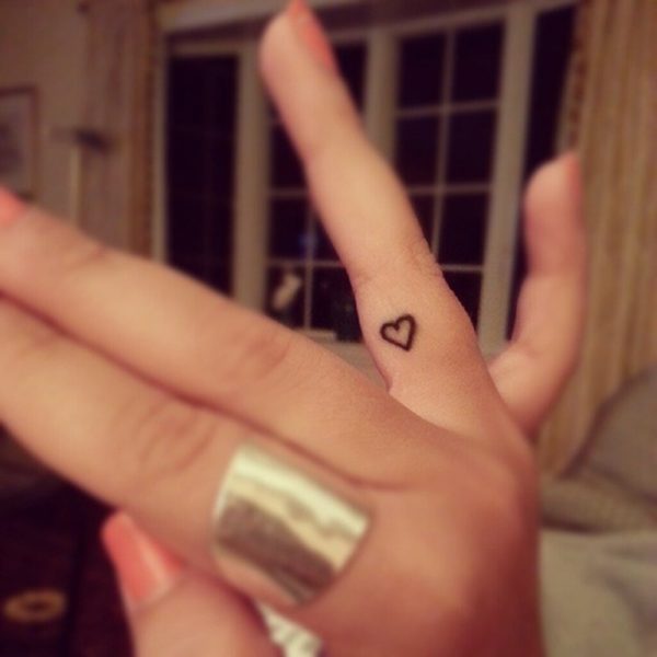 Small Black Outline Heart Tattoo On Finger For Girls